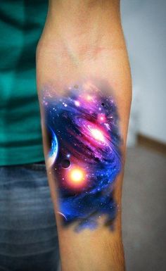 a man with a colorful space tattoo on his arm