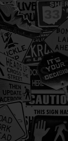 black and white photograph of various street signs