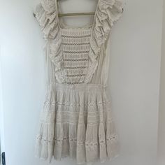 Great As A Bathing Suit Coverup Or As A Fun Dress! Eyelet And Ruffles And A Great Light Material. Worn And Loved! A Small Stain On The Front (Pictured) And Slight Discoloration At The Top Of The Neckline (Pictured). I’m A Size 4 And It Fits Perfectly! Off White Sleeveless Ruffled Mini Dress, Off White Sleeveless Mini Dress With Ruffles, Bohemian Off-white Mini Dress With Ruffles, Off White Bohemian Mini Dress With Ruffles, Off White Ruffled Dress For Day Out, Bathing Suit Coverup, Fun Dress, Bathing Suit Cover Up, Bathing Suit