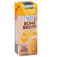 a carton of bone broth with chicken and orange juice on the side,