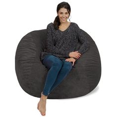 a woman sitting on a bean bag chair