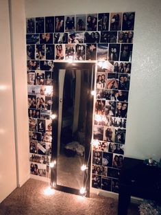 a mirror with lights in front of it and pictures on the wall