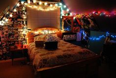 a bedroom decorated with lights and pictures on the wall