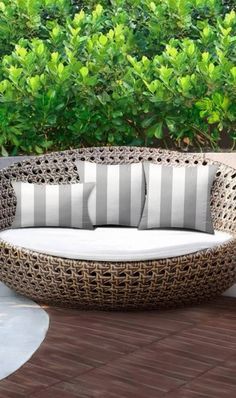 a wicker couch sitting on top of a brick patio