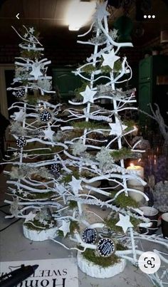 a white christmas tree sitting on top of a table