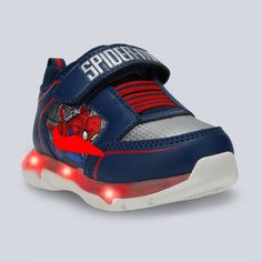 With the Marvel Toddler Spider-Man Athletic Sneakers in Navy Blue and Red, your little one can embark on endless adventures all day. Designed with a round and closed-toe design, these sneakers are designed with your kid's comfort and protection in mind. The adjustable hook and loop strap ensures a secure fit, while the polyester insole material offers cushioning support. Lined with polyester, these sneakers are durable and easy on the feet for prolonged wear. Marvel Shoes, Boys Winter Boots, Marvel Kids, Velcro Sneakers, Light Up Shoes, Mens Winter Boots, Toddler Sneakers, Swim Shoes, Rubber Shoes