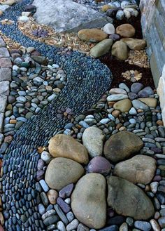 a garden path made out of rocks and stones