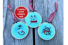 three hand embroidered christmas ornaments hanging on a wooden surface with the text, 12 quick and easy stitchers only