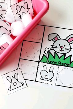 a pink tray filled with marshmallows next to an easter bunny printable