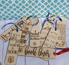 wooden book tags with handwritten words on them