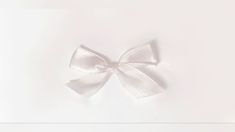 an image of a white bow on the wall