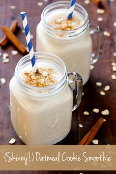 two glasses filled with milk on top of a wooden table next to cinnamon sticks and star anise