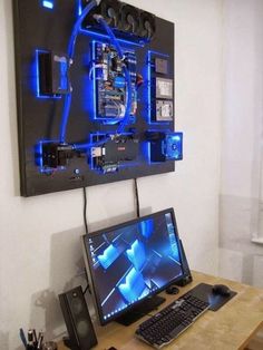 a desktop computer sitting on top of a wooden desk