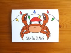 a christmas card with a cartoon crab wearing a santa hat and lights on its head