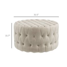 the height of a foot stool with an upholstered design and buttons on it