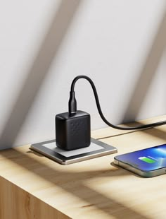 an external charger is plugged into a cell phone and charging it on a wooden table