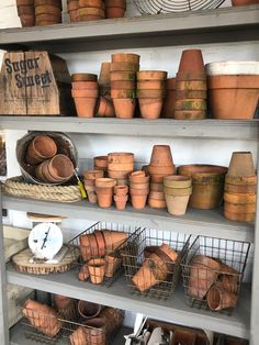 pots and baskets on shelves in a store