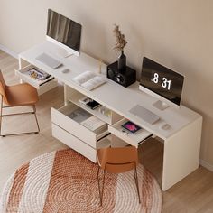 a white desk with two computers on it and some chairs in front of the desk