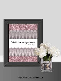 a vase filled with white flowers next to a framed print that says, behold i am with you always