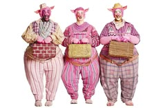 three men dressed in pink and purple are standing next to each other with baskets on their backs