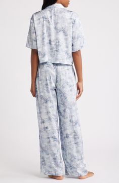 You won't be in any hurry to get dressed in the morning when you're in these relaxed-fit satin PJs featuring a boxy, button-up crop top and matching pants. Top has front-button closure; notched collar; elbow-length sleeves; chest patch pocket Bottoms have elastic waist; side-seam pockets 97% polyester, 3% spandex Machine wash, tumble dry Imported Satin Pjs, Matching Pants, Satin Pajamas, Elbow Length Sleeve, Notched Collar, Pajamas Women, Get Dressed, In The Morning, The Morning