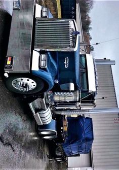 an old truck is parked on the side of the road