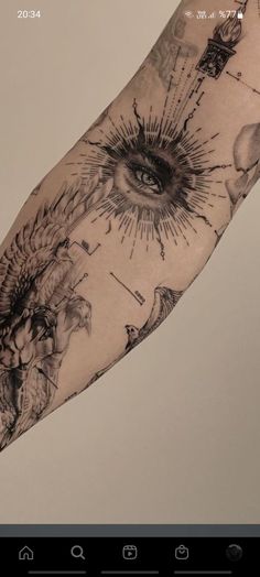 a person with a tattoo on their arm that has an all seeing eye in it