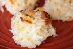 three pieces of coconut cake on a red plate