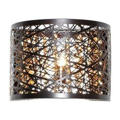 a light fixture that is made out of metal and has an intricate design on it