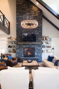 a living room filled with furniture and a fire place