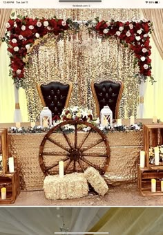 a decorated stage with chairs and flowers on the wall, candles in front of it