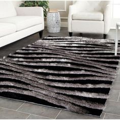 a black and white area rug in a living room