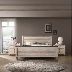 a bedroom scene with focus on the bed and carpeted floor, windows, and rugs