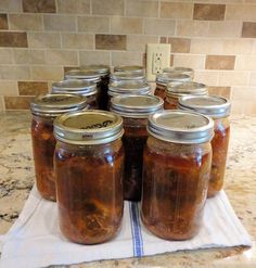 there are many jars of food on the counter