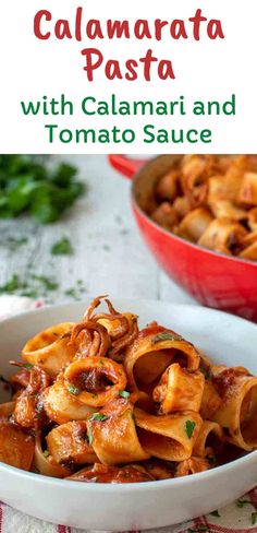 a white bowl filled with pasta and sauce on top of a red table cloth next to a