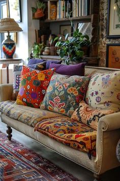 a living room filled with lots of colorful pillows