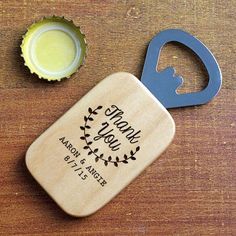 a bottle opener sitting on top of a wooden table