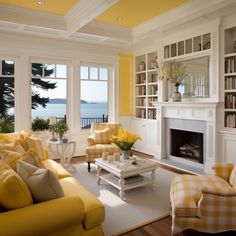 a living room filled with furniture and a fire place in front of a large window