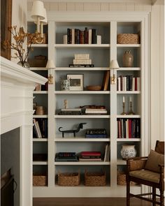 a white bookcase filled with lots of books