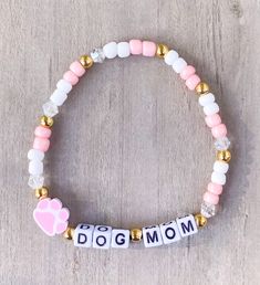 Dog Mom Bracelet  Perfect for a dog mama!  *If you would like something custom or different wording, please put in Personalization section* CARING TIPS FOR YOUR JEWELRY ⭐️Treat and store with care. ⭐️ For longevity, avoid exposing your jewelry to water. ⭐️ Avoid having direct contact with lotions, perfumes, sanitizers as these chemicals may cause discoloration of your jewelry. Dog Mom Bracelet, Lover Bracelet, Dad Bracelet, Dog Bracelet, Apple Watch Bands Fashion, Paw Print Bracelet, Mama Bracelet, Mom Bracelet, Bracelets Ideas