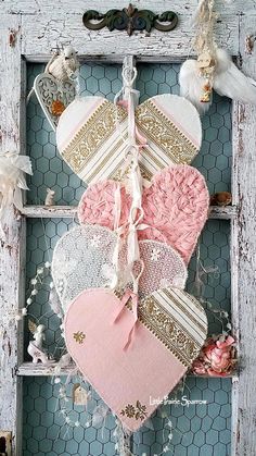 an old window is decorated with hearts and laces for valentine's day decor