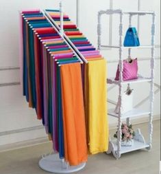 there is a rack with many different colored bags on it