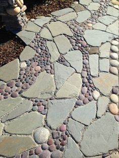 a walkway made out of stones and gravel