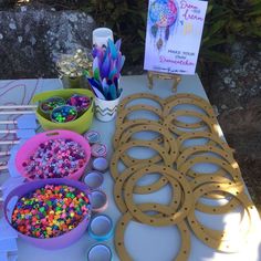 the table is set up with craft supplies for kids to make their own art project