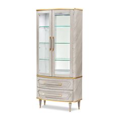 a white and gold display cabinet with glass doors on the front, two drawers at the bottom