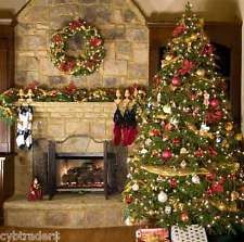 a decorated christmas tree in front of a fireplace