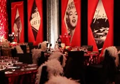 a room filled with lots of tables covered in red and white decorations