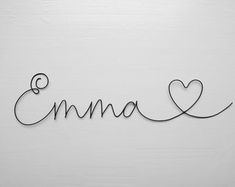 the word love is written in cursive writing