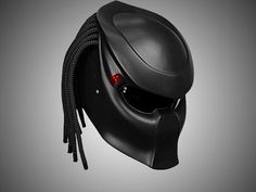 a black helmet with braids on the side and red light coming from it's eyes