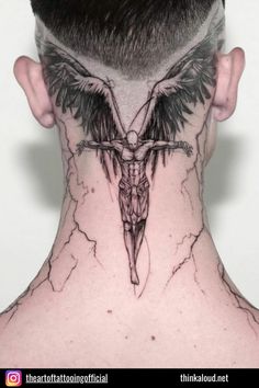 the back of a man's head with a cross and wings tattoo on it